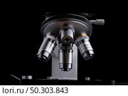 close-up microscope isolated on black background. Стоковое фото, агентство Ingram Publishing / Фотобанк Лори
