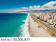 Aerial view of the Antalya city. Mediterranean sea, and the coast of Antalya. Mountains and sky in the background. Turkey. Aerial view of city on the coastline in Turkey. Стоковое фото, агентство Ingram Publishing / Фотобанк Лори