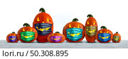 Halloween safety mask as a group of jack o lantern pumpkin wearing a medical face protection as an autumn symbol for disease control and virus infection and coronavirus or covid-19 safety in a 3D illustration style. Стоковое фото, агентство Ingram Publishing / Фотобанк Лори