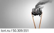 Polluted food and pollution crisis as eating a contaminated meal as chopsticks with industrial toxins or climate change affects on the body with 3D illustration elements. Стоковое фото, агентство Ingram Publishing / Фотобанк Лори