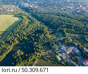 Panoramic view from drone to National Dendrological Park Sofiyivka and the area of city Uman, Ukraine in the summer day. Aerial view from the drone.. Aerial bird’s eye from drone National Dendrological Park Sofiyivka in Uman city, Ukraine. Стоковое фото, агентство Ingram Publishing / Фотобанк Лори