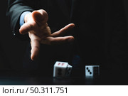 business person hand throw the dice, business gambling game concept. Стоковое фото, агентство Ingram Publishing / Фотобанк Лори