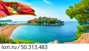 Flag and beach near the island of Sveti Stefan. Стоковое фото, агентство Ingram Publishing / Фотобанк Лори