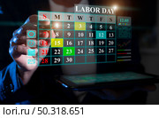 Labor Day planning with a digital calendar reflecting important dates and scheduled activities. Стоковое фото, фотограф Климов Денис / Фотобанк Лори