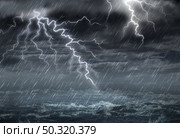 Extreme weather concept with dark storm clouds and stormy destructive winds with heavy rain in a 3D illustration style. Стоковое фото, агентство Ingram Publishing / Фотобанк Лори