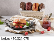 Bolas de Berlim, or "Berlin Balls". Portuguese fried dough with sugar, Filled with sweet cream. Стоковое фото, агентство Ingram Publishing / Фотобанк Лори