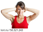Portrait of disturbed young woman putting her finger on the hears. Стоковое фото, агентство Ingram Publishing / Фотобанк Лори