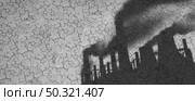 Man-made Climate change and greenhouse gases as a shadow of industrial pollution sources on dried or dry cracked land suffering from drought and heat wave as extreme weather with 3D illustration elements. Стоковое фото, агентство Ingram Publishing / Фотобанк Лори