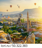 Mosque and air balloons in Goreme, Turkey. Стоковое фото, агентство Ingram Publishing / Фотобанк Лори