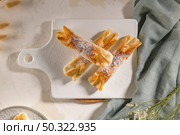 Typical portuguese sweets Pasteis de Vouzela served on countertop. Стоковое фото, агентство Ingram Publishing / Фотобанк Лори