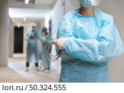 front view doctor wearing protective wear hospital. Стоковое фото, агентство Ingram Publishing / Фотобанк Лори