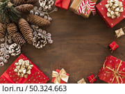 gift boxes with big cones table. Стоковое фото, агентство Ingram Publishing / Фотобанк Лори