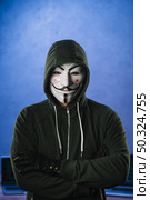 hacker with anonymous mask. Стоковое фото, агентство Ingram Publishing / Фотобанк Лори