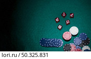 red dices casino chips green poker table. Resolution and high quality beautiful photo. red dices casino chips green poker table. High quality beautiful photo concept. Стоковое фото, агентство Ingram Publishing / Фотобанк Лори