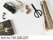 gift box with wrapping paper table. Resolution and high quality beautiful photo. gift box with wrapping paper table. High quality beautiful photo concept. Стоковое фото, агентство Ingram Publishing / Фотобанк Лори