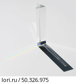 prism dispersing sunlight splitting into spectrum white background. Beautiful photo. prism dispersing sunlight splitting into spectrum white background. Стоковое фото, агентство Ingram Publishing / Фотобанк Лори