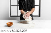 front view man kneading pizza dough. High resolution photo. front view man kneading pizza dough. High quality photo. Стоковое фото, агентство Ingram Publishing / Фотобанк Лори