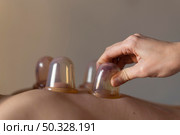 hand holding cup. High resolution photo. hand holding cup. Стоковое фото, агентство Ingram Publishing / Фотобанк Лори