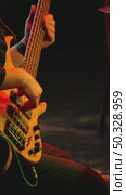 A professional musician plays a five-string bass guitar quickly and skillfully. Concert of jazz or rock band. Стоковое видео, видеограф Воловодов Владимир / Фотобанк Лори