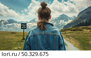 Young woman gazes at snow-capped mountains, standing at a trail start with a sign indicating the beginning of a journey. Стоковое AI-изображение, AI-художник Данила Большаков / Фотобанк Лори