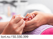 woman having her manicure done close up salon. High resolution photo. woman having her manicure done close up salon. High quality photo. Стоковое фото, агентство Ingram Publishing / Фотобанк Лори