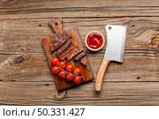 grilled beef steak fresh tomato sauce cutting board. High resolution photo. grilled beef steak fresh tomato sauce cutting board. High quality photo. Стоковое фото, агентство Ingram Publishing / Фотобанк Лори