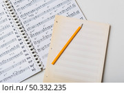 pencil mpty pages sheet music. High resolution photo. pencil mpty pages sheet music. High quality photo. Стоковое фото, агентство Ingram Publishing / Фотобанк Лори