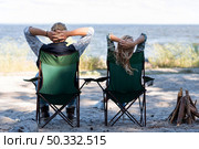couple sitting chairs from shot. High resolution photo. couple sitting chairs from shot. High quality photo. Стоковое фото, агентство Ingram Publishing / Фотобанк Лори
