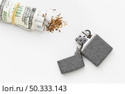 bills with cigarettes lighter. Стоковое фото, агентство Ingram Publishing / Фотобанк Лори