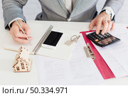crop realtor counting writing. Стоковое фото, агентство Ingram Publishing / Фотобанк Лори