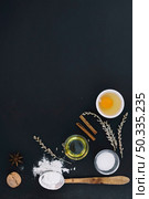 high angle view various baking ingredients black background. Стоковое фото, агентство Ingram Publishing / Фотобанк Лори