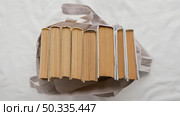 top view books stack bag. Стоковое фото, агентство Ingram Publishing / Фотобанк Лори