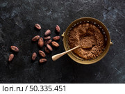 top view bowl with cocoa powder cocoa beans. Стоковое фото, агентство Ingram Publishing / Фотобанк Лори