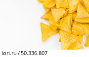 OLYMPUS DIGITAL CAMERA. pile nachos white background. Стоковое фото, агентство Ingram Publishing / Фотобанк Лори