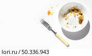 top view dirty plate with food leftovers. Стоковое фото, агентство Ingram Publishing / Фотобанк Лори