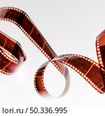 twisted undeveloped film strip isolated white background. Стоковое фото, агентство Ingram Publishing / Фотобанк Лори
