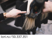 crop stylist setting hair with brush. Стоковое фото, агентство Ingram Publishing / Фотобанк Лори
