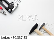 hammers repair word written with nails. Стоковое фото, агентство Ingram Publishing / Фотобанк Лори