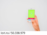 hand holding phone with snapchat copy space. Редакционное фото, агентство Ingram Publishing / Фотобанк Лори