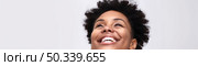Detailed view of a person with a voluminous afro hairstyle, showcasing the texture and beauty of their natural hair. Стоковое AI-изображение, AI-художник Данила Большаков / Фотобанк Лори