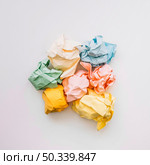 elevated view crumple paper isolated white background. Стоковое фото, агентство Ingram Publishing / Фотобанк Лори