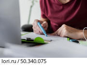 guy using highlighter his papers. Стоковое фото, агентство Ingram Publishing / Фотобанк Лори