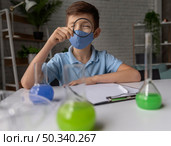 medium shot boy wearing mask. Стоковое фото, агентство Ingram Publishing / Фотобанк Лори