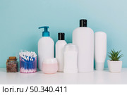 plant cotton swabs near cosmetics bottles. Стоковое фото, агентство Ingram Publishing / Фотобанк Лори