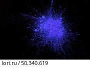 splash dark blue holi color black surface. Стоковое фото, агентство Ingram Publishing / Фотобанк Лори