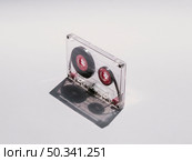 diagonal close up shot clear cassette tape. Стоковое фото, агентство Ingram Publishing / Фотобанк Лори