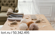 arrangement with knitting tools indoors. Стоковое фото, агентство Ingram Publishing / Фотобанк Лори