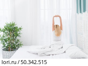 back view adult woman waking up home. Стоковое фото, агентство Ingram Publishing / Фотобанк Лори