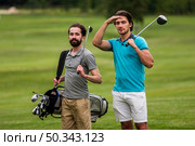 front view adult friends playing golf. Стоковое фото, агентство Ingram Publishing / Фотобанк Лори