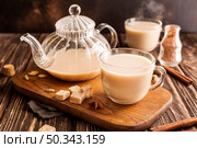 front view milk tea concept with cinnamon. Стоковое фото, агентство Ingram Publishing / Фотобанк Лори